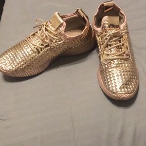 Rose gold sneakers.